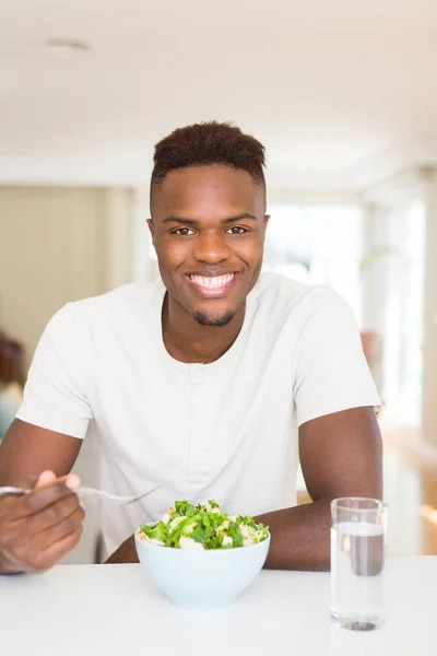 imgi 186 depositphotos 277776902 stock photo handsome african young man eating